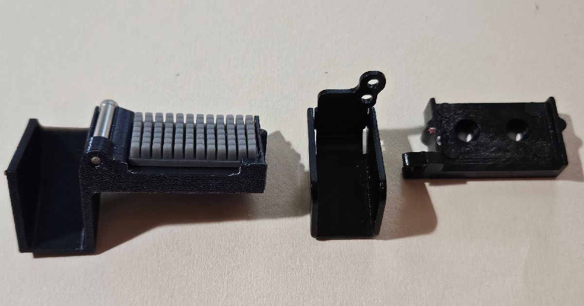 Parts of a reinforced Q1 Pro nozzle wiper base with a silicone brush