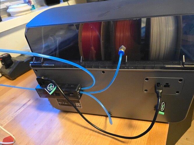 Blue Capricorn tubes connected to CFS on the back of Creality K2 Plus