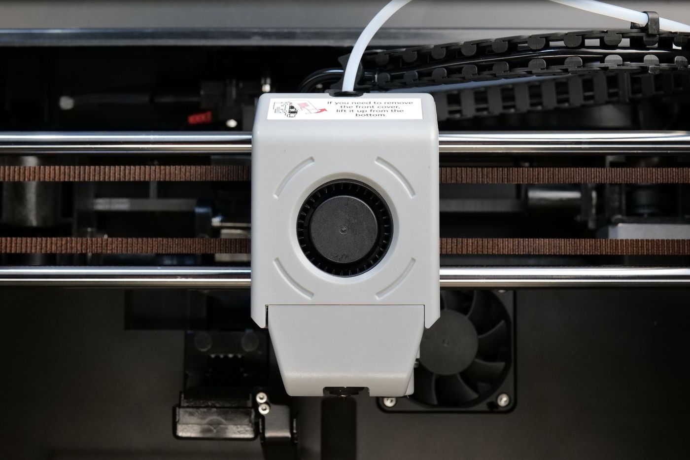 QIDI Q1 Pro toolhead with the turbo fan cover and a label about removing the front cover