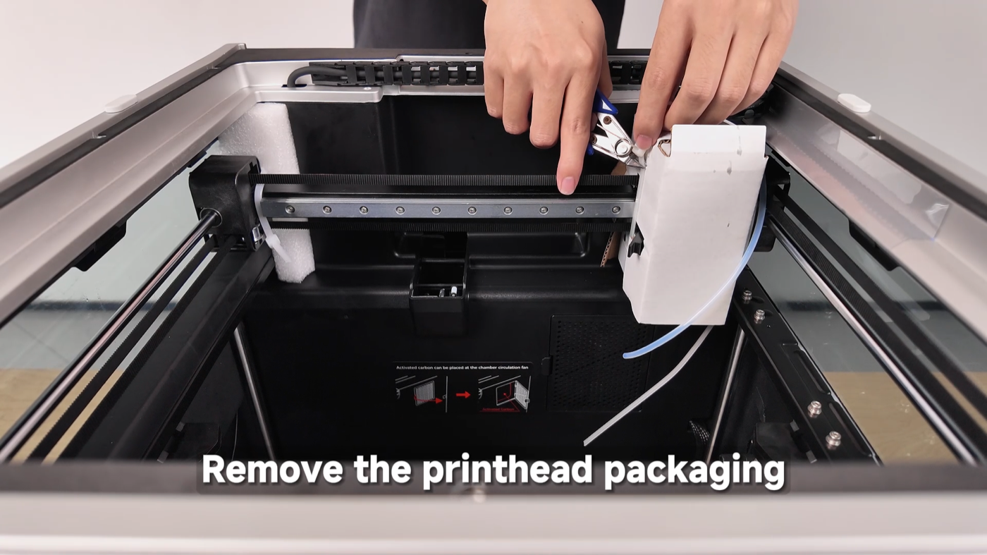 Cutting the print-head packaging and zip ties on the QIDI Q2