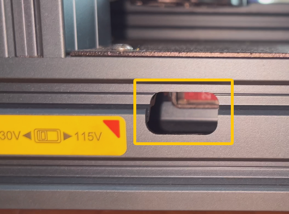 Переключатель напряжения 115/230 В в глубине блока питания Neptune 4 Max