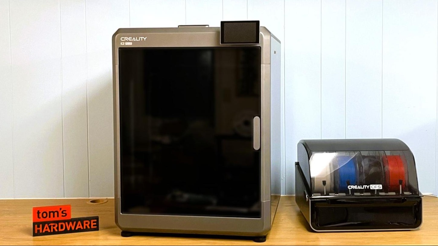 Creality K2 next to CFS unit on a workshop desk