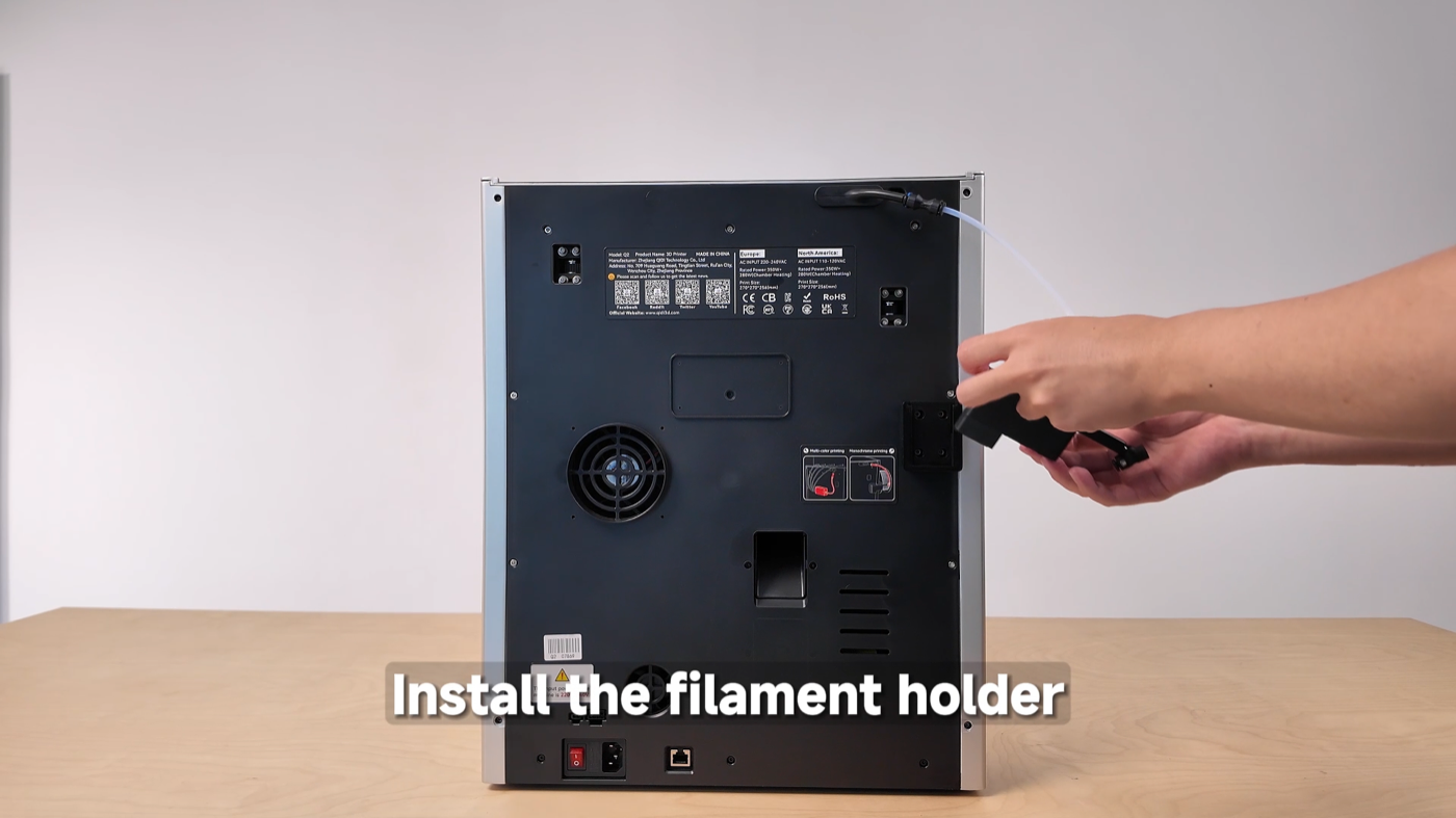 Installing the spool holder on the rear panel of the QIDI Q2