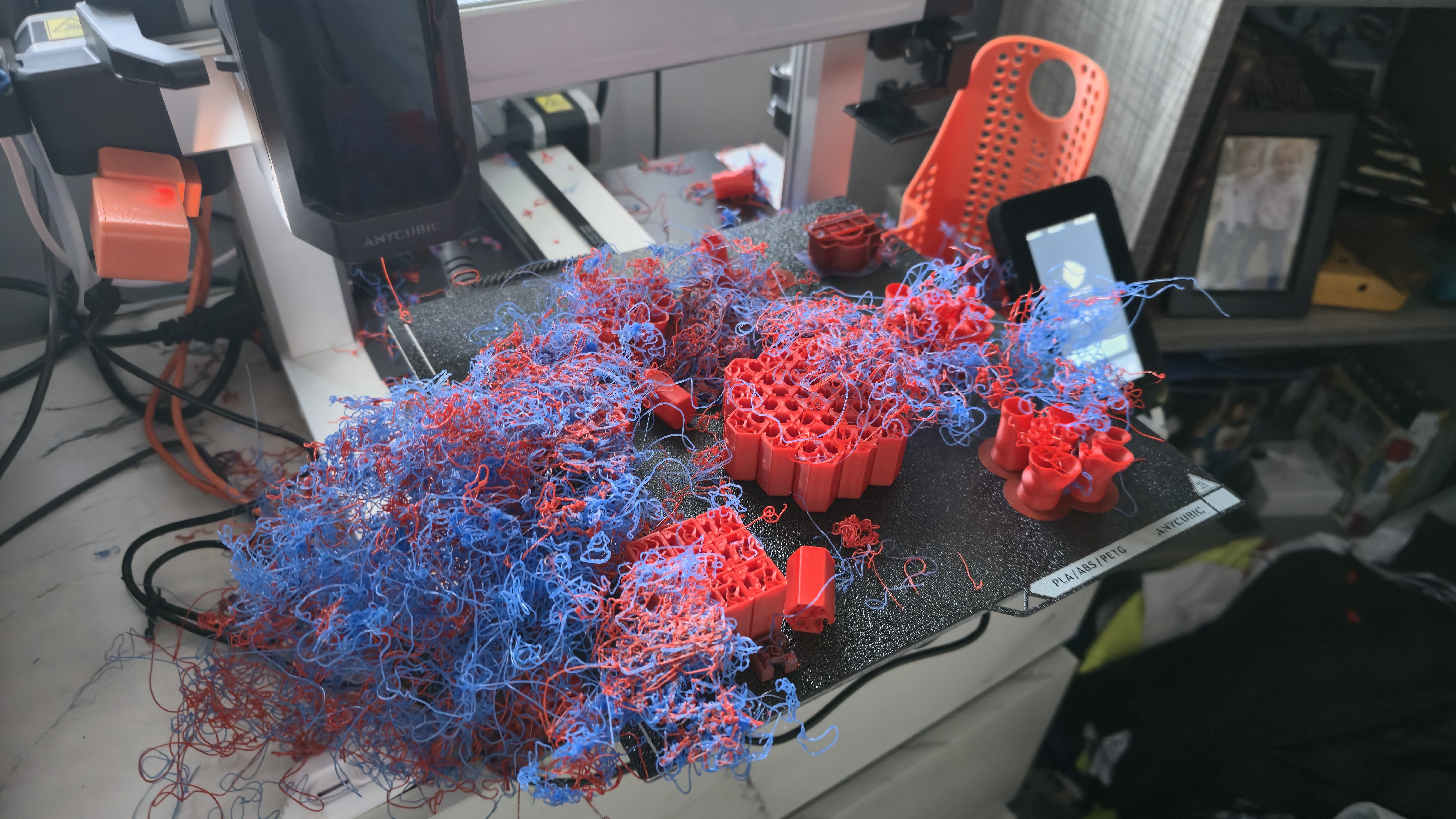 A failed multicolor print: red and blue filament spaghetti