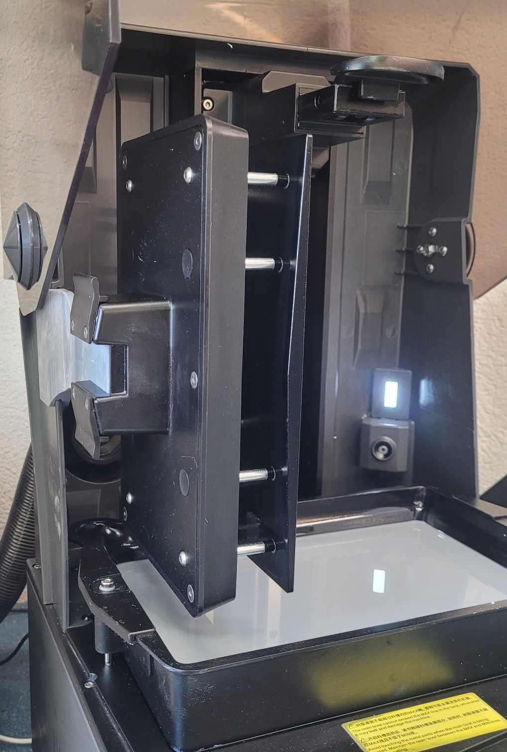 Simple printed drip bracket on a Saturn 4 Ultra 16K build plate