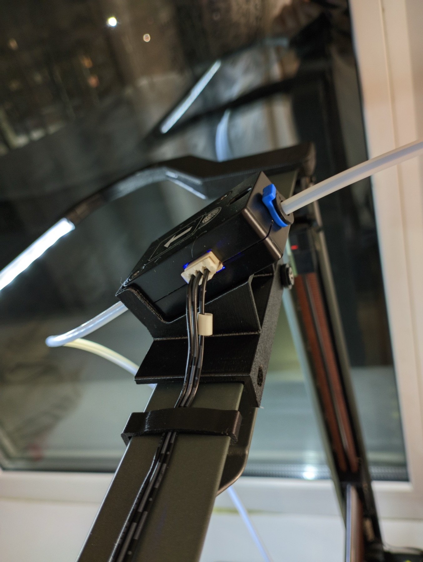 Stock Ender-3 V3 filament runout sensor relocated to a printed bracket at the top of the frame