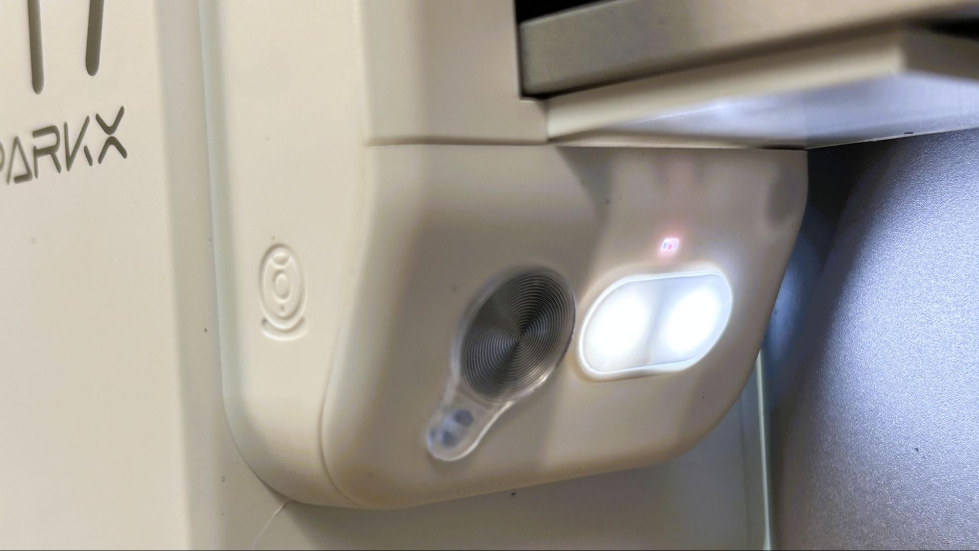 SPARKX i7 720p AI camera and LED — close-up of the lens and privacy shutter
