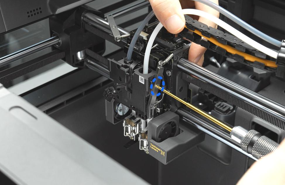 Lifting the X2D extruder assembly out along with its PTFE tubes