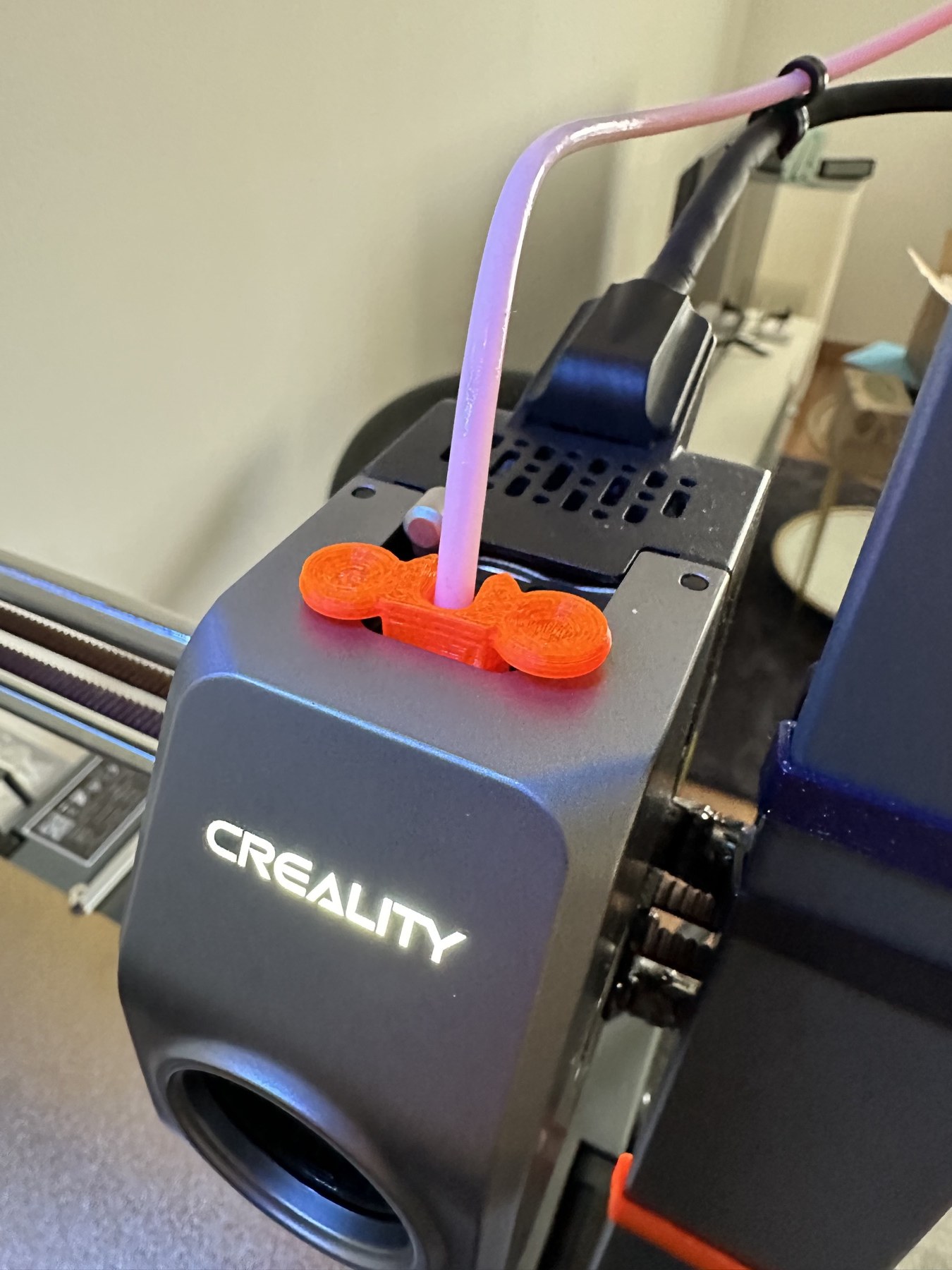 Orange printed PTFE tube remover on an Ender-3 V3 toolhead