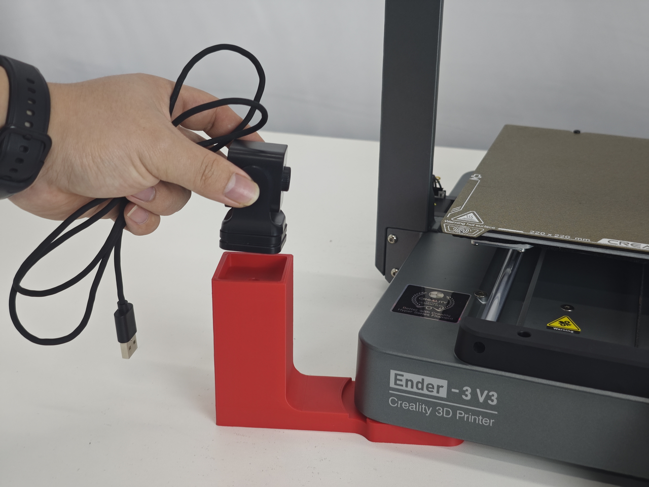 Installing the Nebula camera on its bracket at the base of an Ender-3 V3