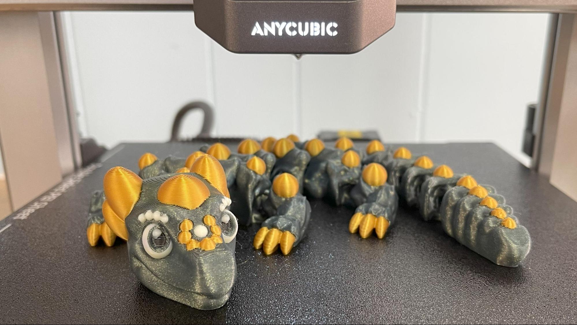 An articulated dragon in two colors