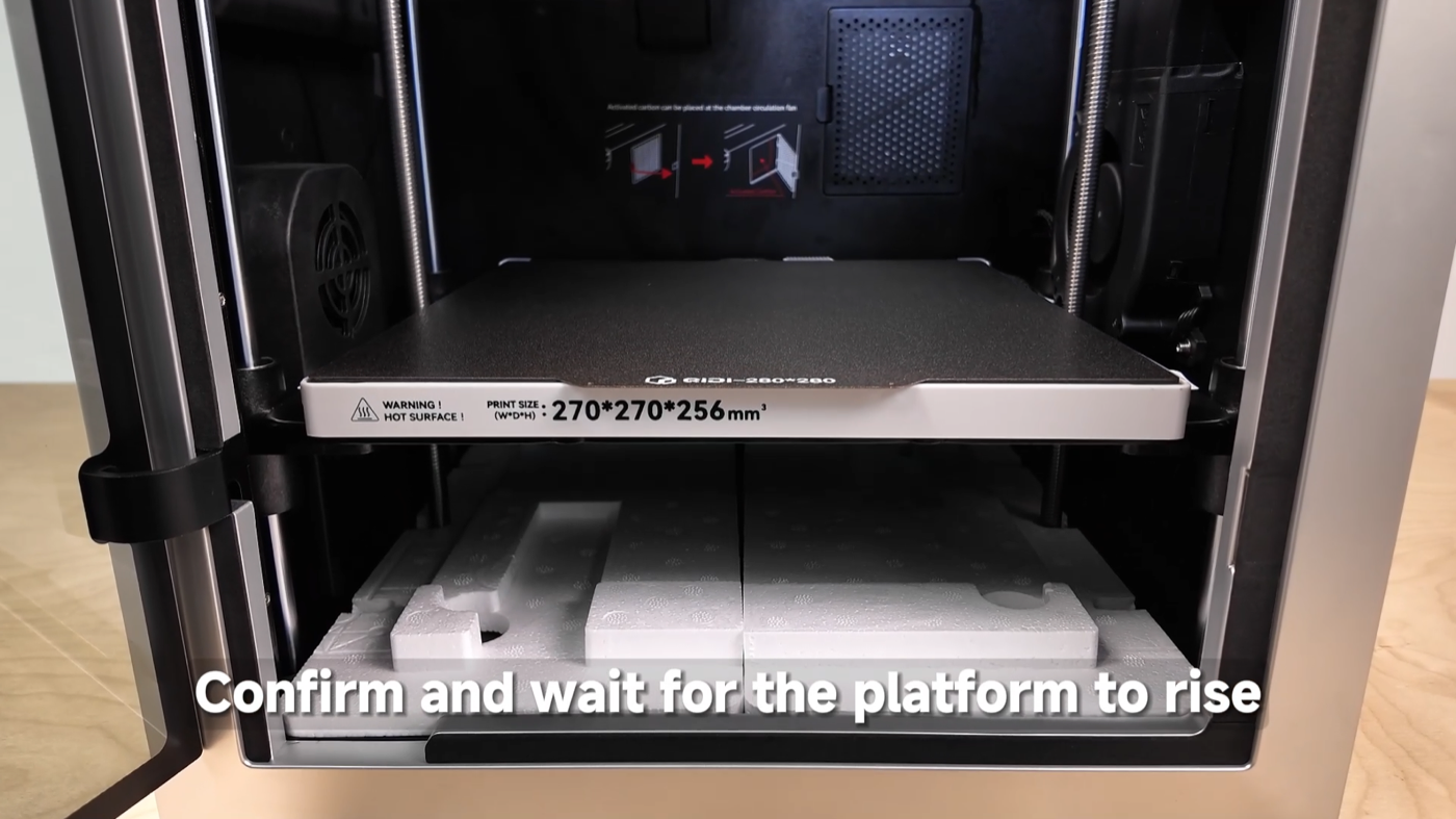 QIDI Q2 bed labeled 270×270×256 mm rising over a foam block