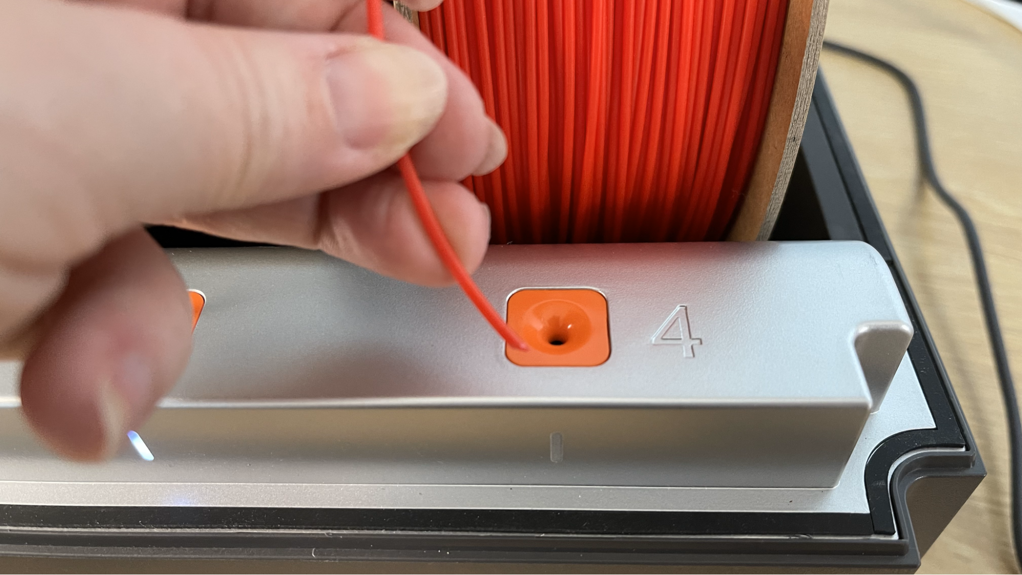 Each spool feeds into its own slot