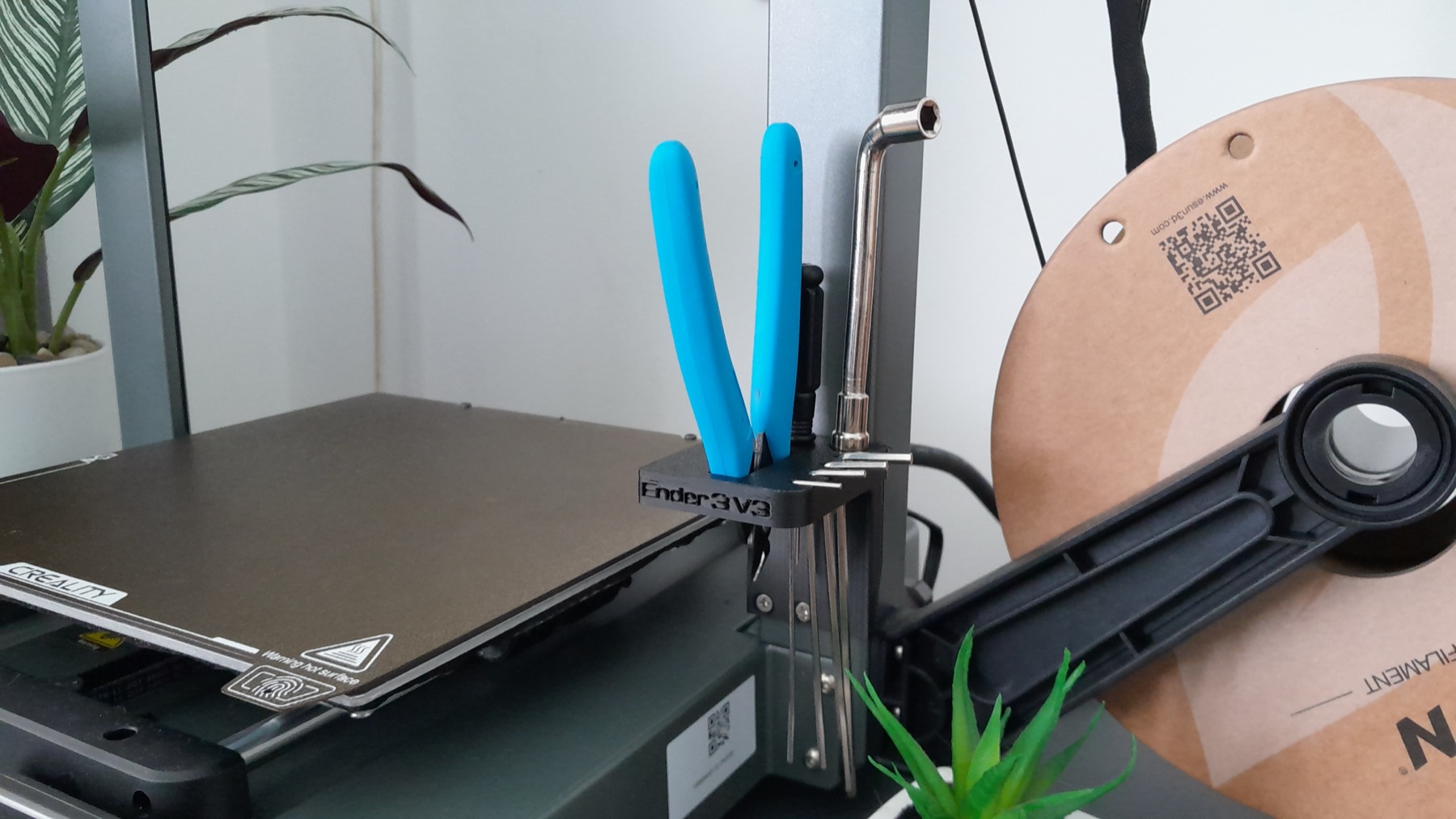 Printed tool holder labeled Ender 3 V3 with flush cutters