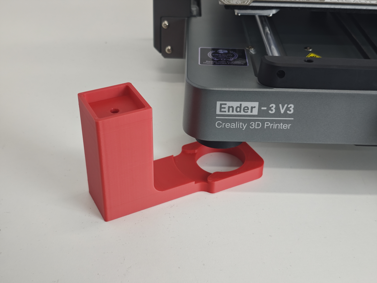 Printed Nebula camera bracket next to a Creality Ender-3 V3